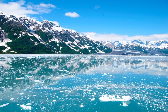 Alaskan glacier with a cone-shaped mountain in the background